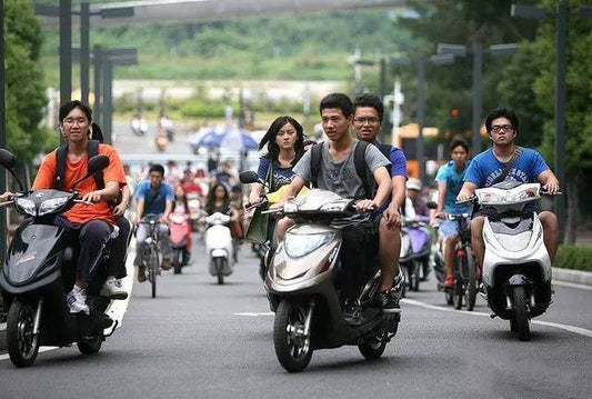Why are electric vehicles poised to replace motorcycles as the primary mode of urban transportation in the future?
